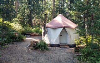 Sleeps: 2 This glamping yurt is located in the G loop and is the most secluded yurt in the campground. It comes with a memory foam bed, wood burning stove and a well appointed living quarter which includes a dresser, chairs, rugs throughout and linen service. The site has a picnic table and fire-pit. No pets allowed.