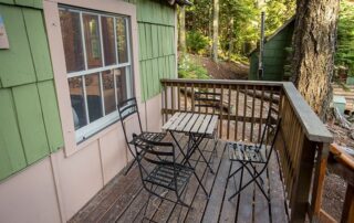 Cabin five. 2025. Front view. One queen bed. One bunk bed. Electricity, small fridge, microwave and coffee maker.